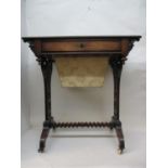 A Victorian rosewood work table with a drawer, wool drawer and carved brackets, over fretworked