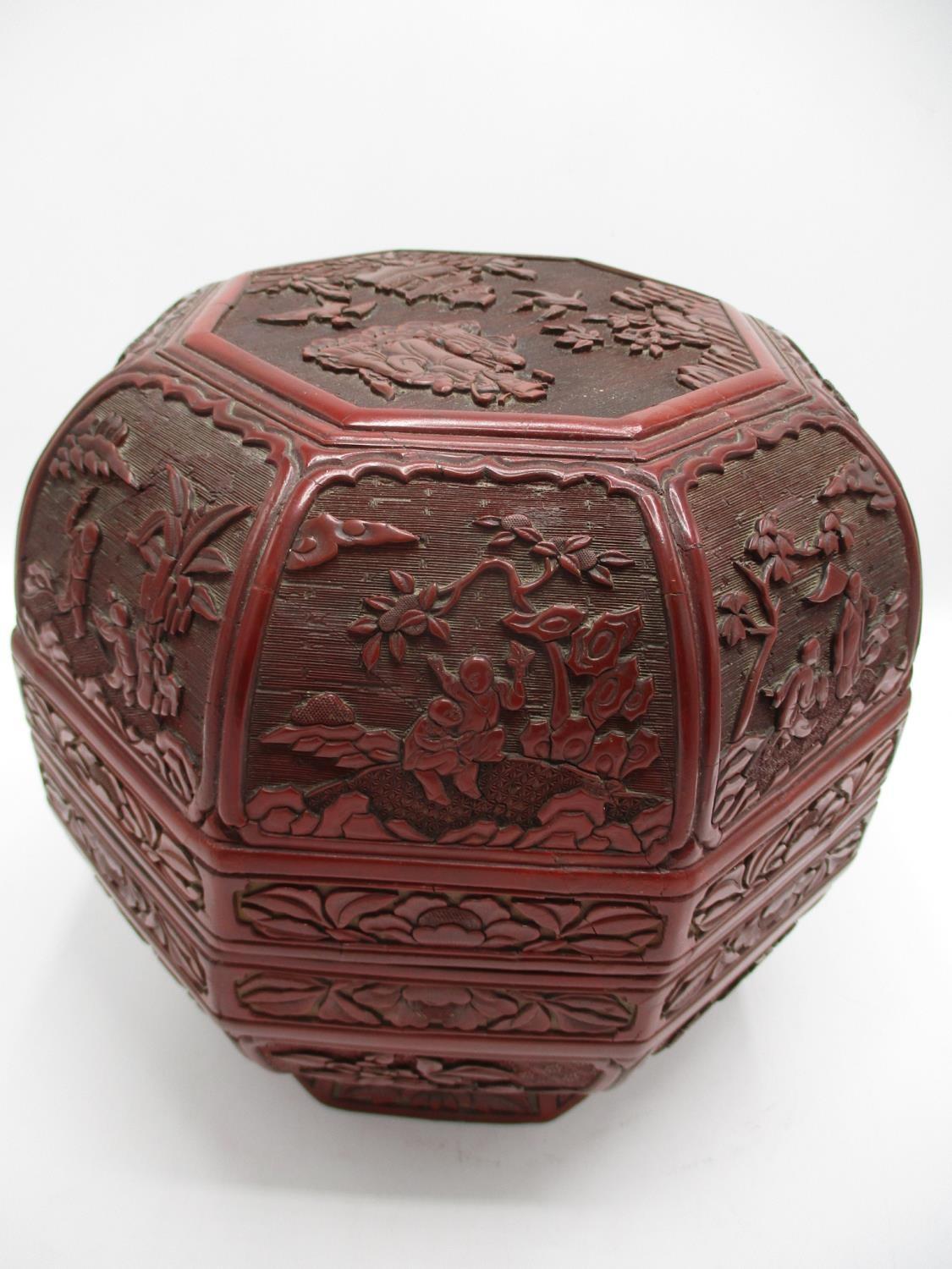 A large 19th century Chinese cinnabar box of octagonal form, the domed lid decorated with panels - Image 3 of 17