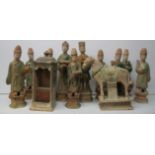 A collection of nine Chinese Ming terracotta tomb figures, dressed as scholars in green glazed robes
