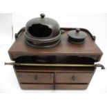 A late 19th century Chinese elm and bronze opium chest, with a swing handle, two lidded pots and a