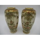 A pair of Japanese Meiji period Satsuma vases of tapered form, decorated with birds in flight,