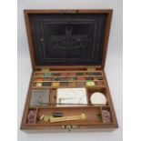 A Victorian mahogany cased artist box, the interior of the hinged lid decorated with a house,