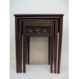 A nesting set of three early 20th century Anglo Indian carved hardwood occasional tables with vine