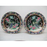 A pair of late 19th century/early 20th century Japanese chargers with a wavy rim, decorated with a