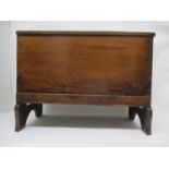 A 17th/18th century boarded oak chest of small proportions, with a hinged top, over chip carved