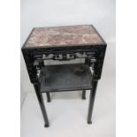 A late 19th century Chinese carved hardwood table with mottled marble top, floral carved and pierced
