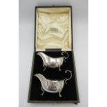 A pair of early 20th century silver sauce boats by Adie Brothers, Birmingham 1926, with reeded rims,
