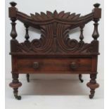 A William IV rosewood Canterbury with four divisions, the front and back with scroll, carved