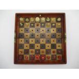 A Victorian Jaques patentee "In Status Quo" portable chess set, the folding mahogany board inset