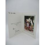 A Royal Family Christmas card containing a photograph of Prince William, Prince Harry, Princess