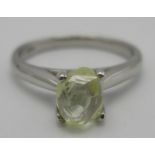 A platinum diamond ring with a fancy intense yellow, flawless clarity F and a marche octahedral