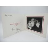 A Royal Family Christmas card containing a photograph of Lady Diana, William and Harry with text,