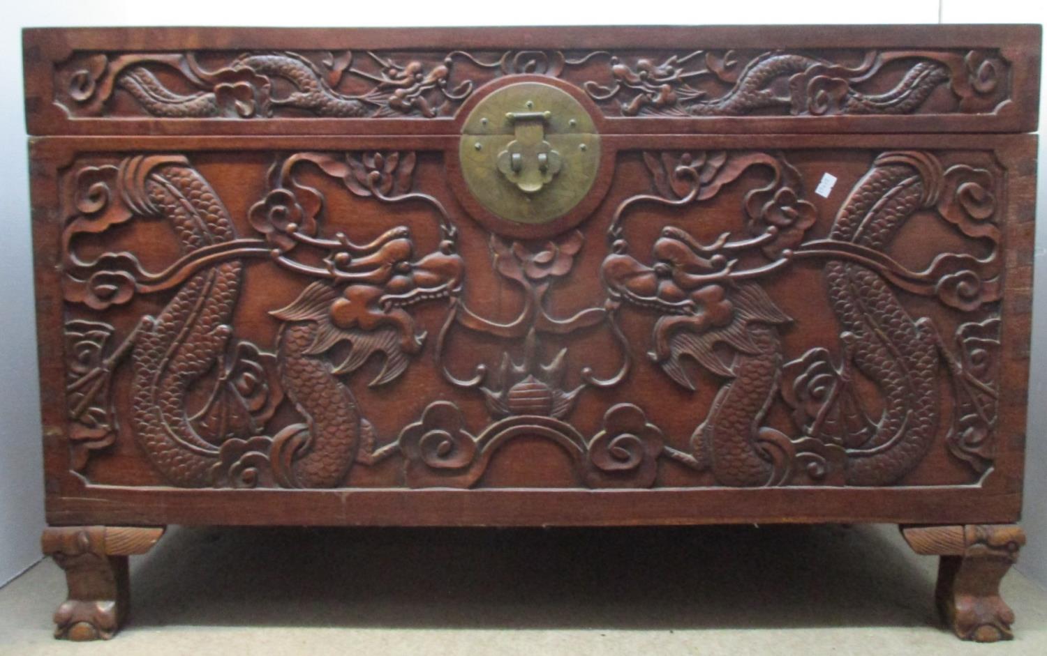 An early 20th century Chinese hardwood chest, the top, front and sides carved with dragons and - Image 3 of 6