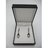 A pair of silver drop earrings set with pearls, rubies and diamonds, boxed