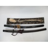 A Japanese Koshirae Katana sword designed with a decorated lacquered saya, the sword with pierced
