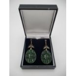 A pair of Asian 9ct gold and silver drop earrings, the carved and pierced jade panels decorated with