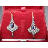 A pair of silver flared drop earrings set with a central sapphire and diamonds, boxed