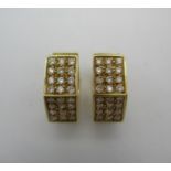 A pair of 18ct yellow gold faceted earrings two sides each set twelve diamonds, 1.5cm wide, 7.8grams