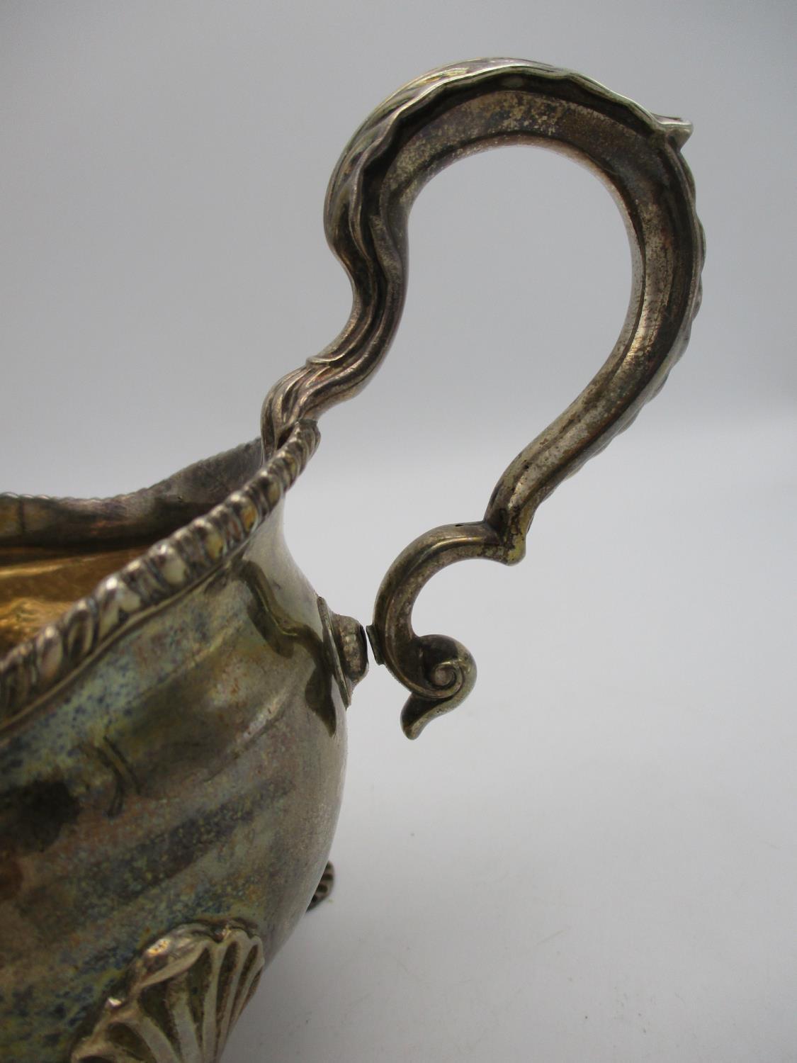 A George II silver sauce boat by Daniel Smith & Robert Sharp, London 1759, modelled with a gadrooned - Image 2 of 5