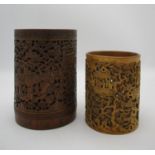 A Chinese Qing dynasty carved bamboo brush pot, the front with carved figural scene flanked either