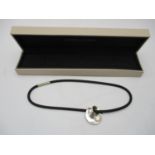 A Georg Jensen silver Mobius No 374 pendant on a later necklace, boxed