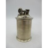 A George V silver table lighter by The Goldsmith and Silversmith Company Ltd, with cylindrical