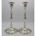 A pair of William IV silver candlesticks by John Green & Co, Sheffield 1834, in the Georgian taste