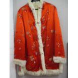 A 1970's custom made red silk ladies jacket purchased in Hong Kong having a foliage design and a