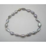 A single strand baroque pearl necklace, with a white metal magnet clasp, 41 cm long