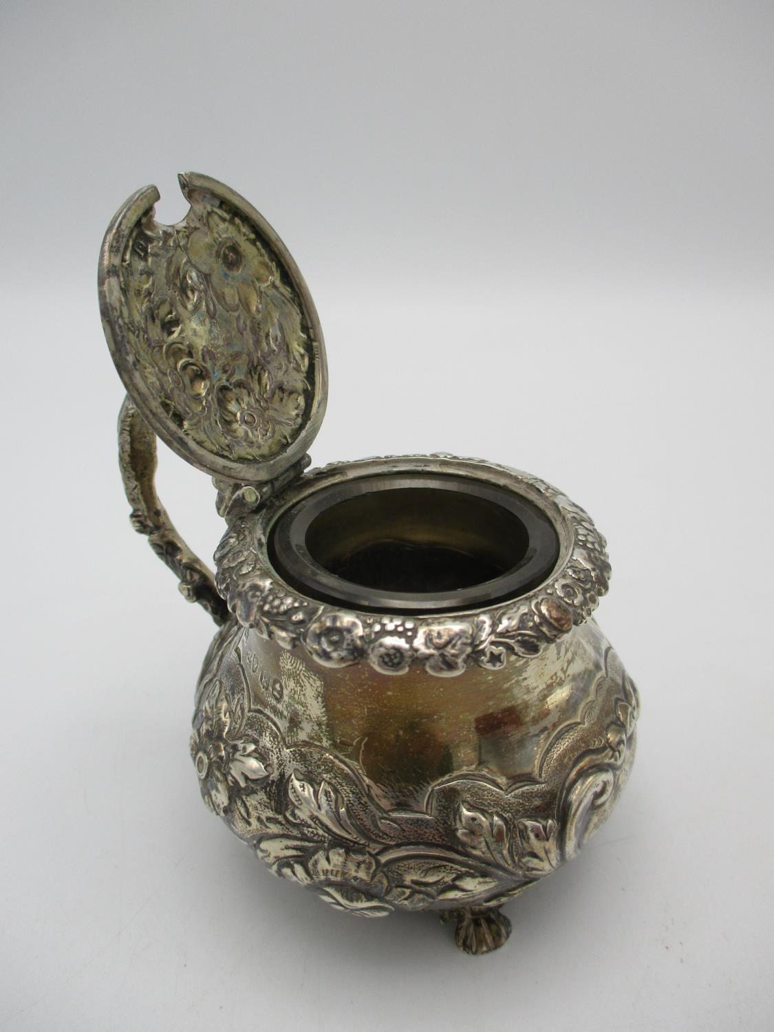 A George IV silver mustard pot by Joseph Biggs, London 1825, of bulbous form with embossed foliage - Image 3 of 4