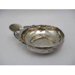 An early 19th century French silver porringer, with makers initials M/I?, the edge of the bowl