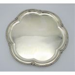A George V silver salver by Levesley Brothers, Sheffield 1910, with lobed rim with flower detail