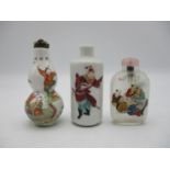 A small collection of three Chinese scent bottles, to include a rouleau model with applied enamels