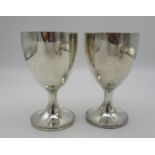 A pair of George III silver goblets by Henry Chawner, London 1789, with plain bodies on short