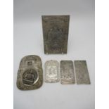 Three Chinese white metal ingot plaques, depicting relief decorations of figural and naturalistic