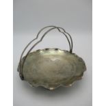 An early 20th century Chinese export silver basket, by Tackhing, with lobed double handle and