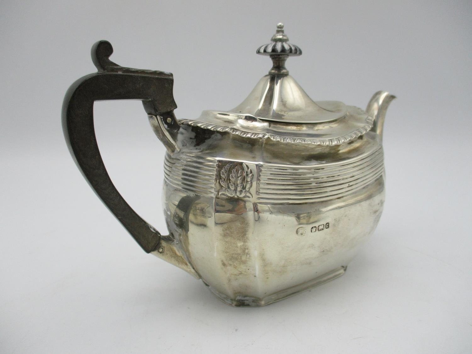 A late Victorian silver three piece tea set by John Round & Son, Sheffield 1895, retailed by Edwards - Image 2 of 4