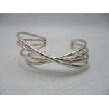 A Georg Jensen silver Alliance bangle with four crossover bands, boxed
