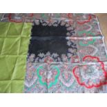 A 20th Century Chanel cream scarf with black hand sewn border and a single floral image in black,