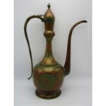 A large Persian kahmiri enamelled brass ewer, extensively decorated with red ground enamel and