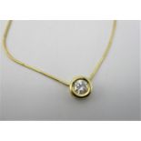 An Italian gold coloured necklace with a diamond set pendant in a rub-over setting 0.65ct