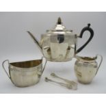A George V silver three piece tea set by Alexander Clark & Co Ltd, Sheffield 1923, comprising a