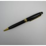 A Replica Montblanc Meisterstruck ball point pen, black with gold trim