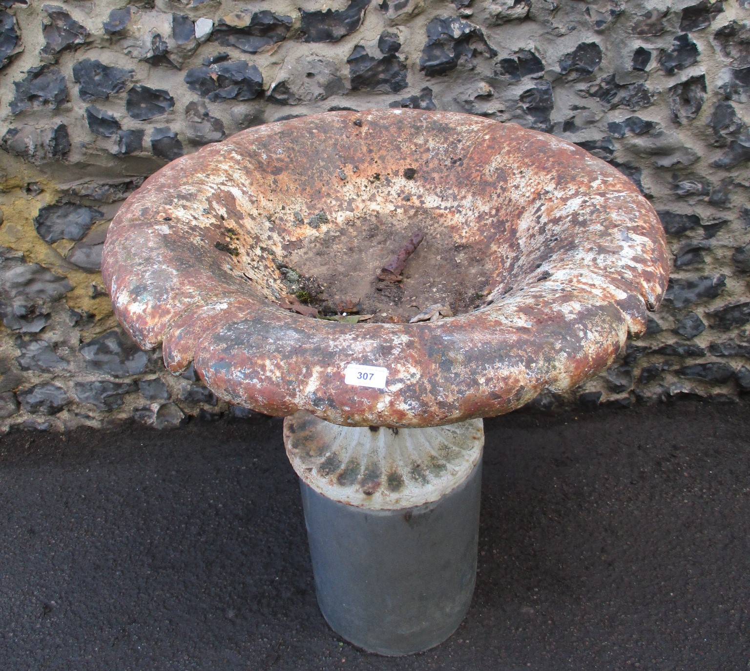 A Victorian part painted cast iron garden planter, the shallow bowl with a shaped, foldover rim,