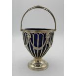 An Edward VII silver swing handle sugar bowl by Goldsmiths and Silversmith co., with pierced body