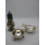 An Edwardian silver sugar caster by Harrison Brothers and Howson, London 1909, together with a mid