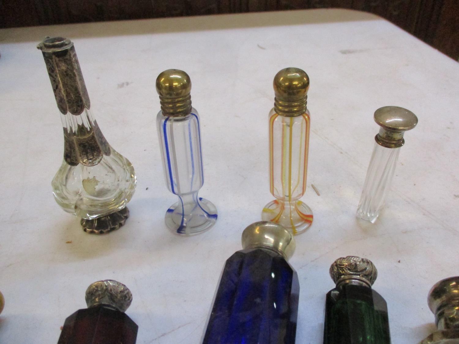 A quantity of Victorian and later scent bottles to include double ended and silver topped bottles, - Image 2 of 2