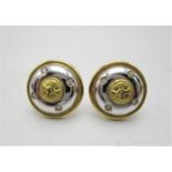 A pair of 18ct yellow and white gold domed earrings each set with four diamonds, 5.3grams in a Payne