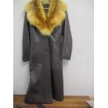 A retro ladies dark brown leather coat with red fox fur collar, together with a full length mid