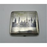 An early 20th century Egyptian silver Niello card case of curved, cushion form decorated with the